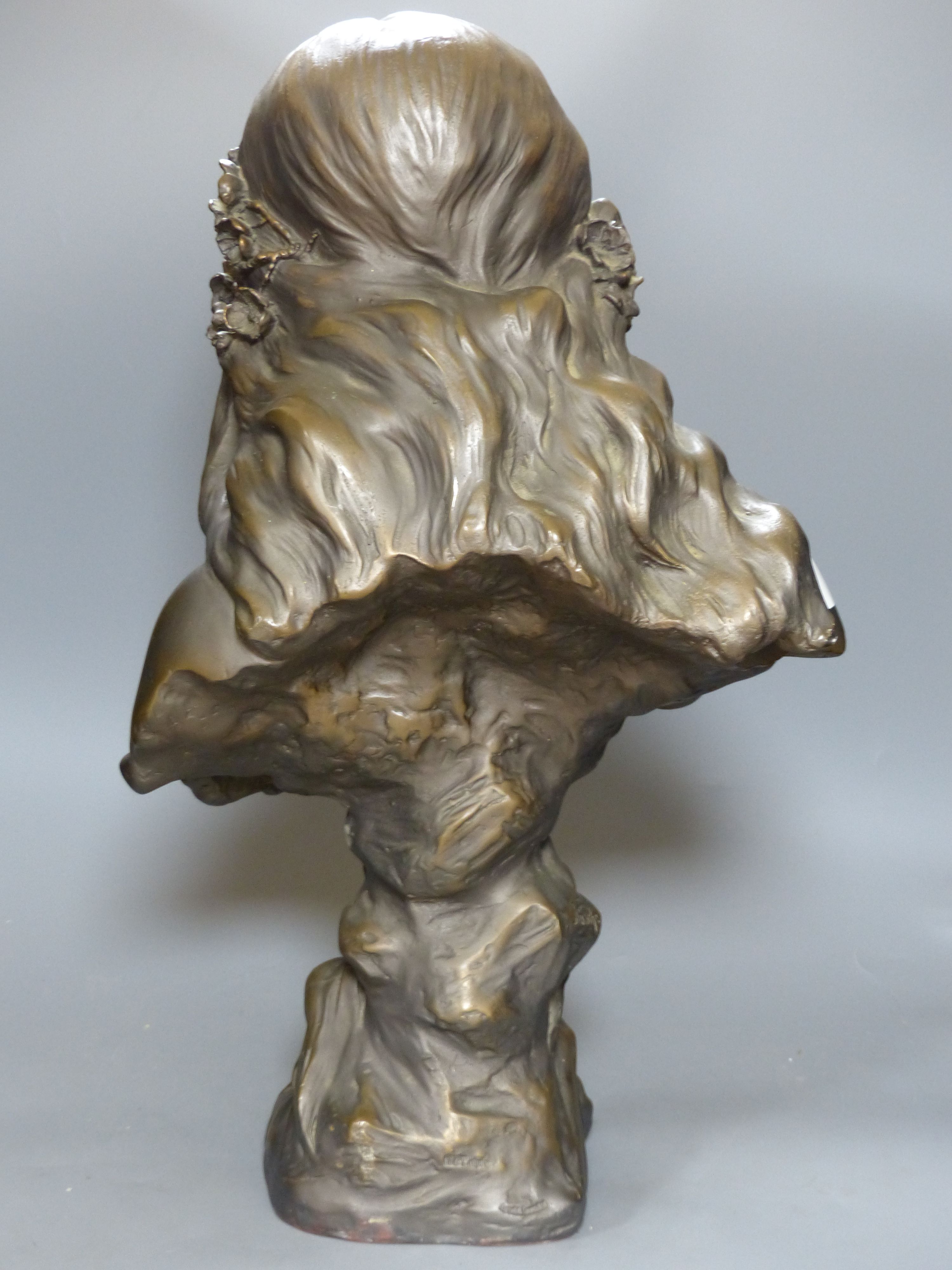 An Art Nouveau style composition bust of a girl, height 60cm